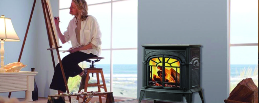 Woman painting in beach side house with gas stove