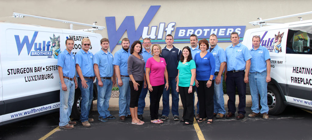 Wulf Brothers staff standing together in front of building